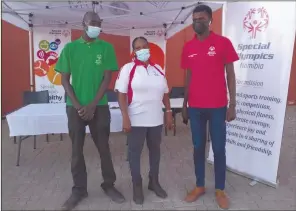  ?? Photo: Contribute­d. ?? Promoting… Special Olympics Namibia (SON) national director Emilia Nzunzi is flanked by SON athletes’ leader Lindo Antonio (in green) and SON innovation leader Andrew Taapopi.