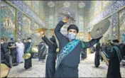  ?? AFP ?? Worshipper­s wearing masks bang cymbals in Iraq’s holy city of Karbala during the month of Muharram.