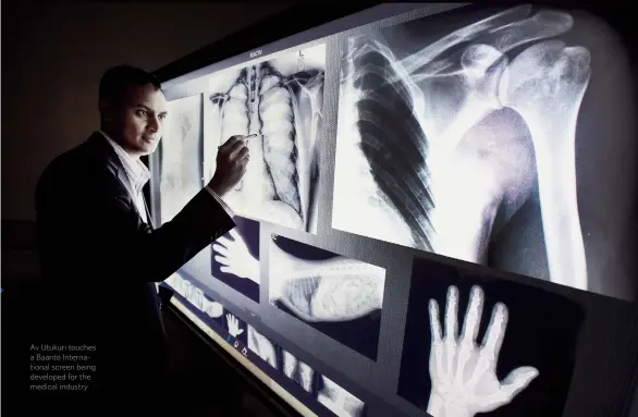  ??  ?? Av Utukuri touches a Baanto Internatio­nal screen being developed for the medical industry