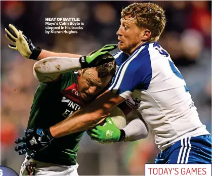 ??  ?? HEAT OF BATTLE: Mayo’s Colm Boyle is stopped in his tracks by Kieran Hughes
