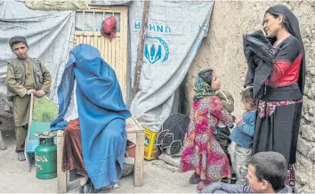  ??  ?? HIDEOUT: The Zanabad ‘Widows Hill’ formed in the 1990s so women could escape the stigma of being widows in Afghanista­n.