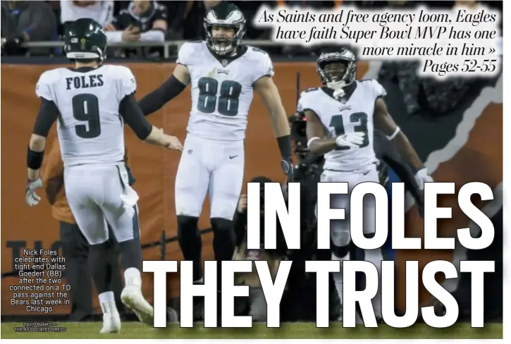  ?? DAVID BANKS — THE ASSOCIATED PRESS ?? Nick Foles celebrates with tight end Dallas Goedert (88) after the two connected on a TD pass against the Bears last week in Chicago.