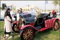 ?? ?? Egyptian collector Mohamed Wahdan talks to people about his 1924 Ford T at a public show in Cairo, Egypt, Saturday, March 19, 2022. (AP)