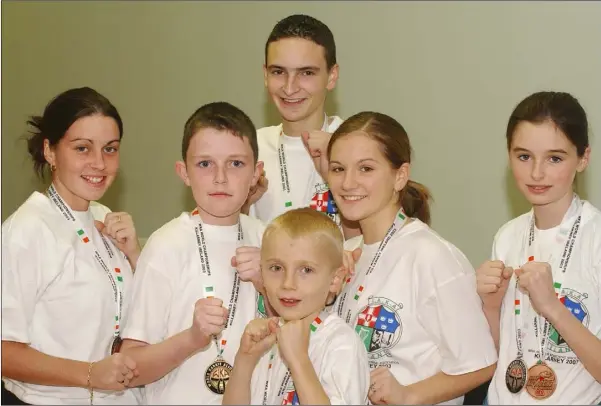  ??  ?? Members of the 2003 Cobra Kan Kick Boxing Team who were medal winners at the WKA World Championsh­ips held in Killarney. Included are (L-R) Catherine Brady, Silver, Andrew McDonald, Gold, Conor Hernon (Front) Bronze, Shane Hutchinson, Gold, Niamh Higgins, Bronze and Lorna King, Silver and Bronze.