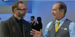  ??  ?? Jim Martyn, right, chats with GM’s Kirk Bennion at the 2014 AutoShow.