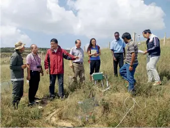  ??  ?? Professor Xiong (third left) works with his research team on an ecosystem restoratio­n site of Beishan Field Experiment­al Station of Dryland Agro-ecology, Lanzhou University, China in August 2015.