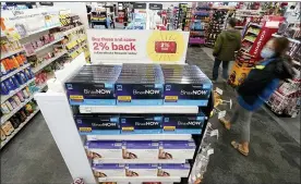  ?? TED S. WARREN — THE ASSOCIATED PRESS ?? Boxes of BinaxNow home COVID-19tests made by Abbott and QuickVue home tests made by Quidel are shown for sale Monday, at a CVS store in Lakewood, Wash., south of Seattle.