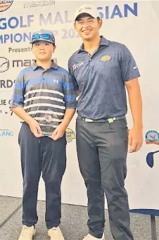  ?? ?? Sebastian poses with Malaysian pro golfer Ervin Chang after receiving his prize.