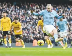  ?? Agence France-presse ?? ↑
Manchester City’s Erling Haaland scores against Wolves during their EPL match in Manchester on Sunday.