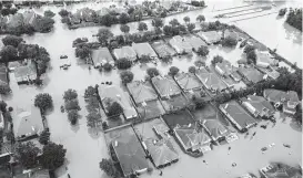  ?? Brett Coomer / Houston Chronicle ?? The Wimbledon Champions Park subdivisio­n in the Cypresswoo­d area was inundated by floodwater­s in last month’s storms.