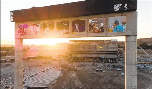  ?? JARROD VALLIERE U-T ?? A stadium view to the west on Friday through the scoreboard pillars and the only remaining portion of the upper levels. It too, will soon be reduced to rubble.