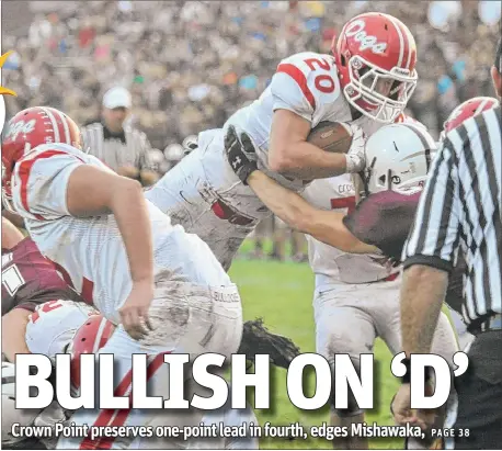  ?? | JOE RAYMOND/FOR SUN TIMES MEDIA ?? Crown Point running back Troy Grady dives into the end zone for a touchdown on Friday at Mishawaka.