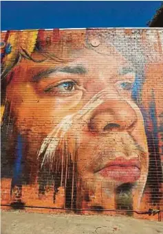 ??  ?? Indigenous Australian man by Melbourne artist Adnate.