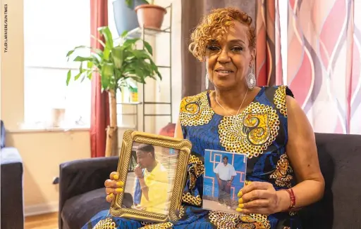  ??  ?? Roxanne Smith, a longtime leader with Communitie­s United, holds photos of her sons Roget (left) and Seneca, both of whom she says were victims of police brutality.