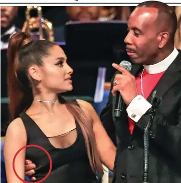  ??  ?? ‘Crossed the line’: Bishop Charles Ellis III’s hand, circled, grips Ariana Grande