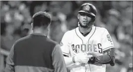  ?? GREGORY BULL/AP ?? Padres rookie Fernando Tatis Jr. likely will miss the rest of the season with a back injury.