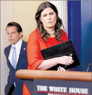  ?? AP/ALEX BRANDON ?? Anthony Scaramucci, incoming White House communicat­ions director, follows new White House press secretary Sarah Huckabee Sanders into the briefing room Friday at the White House.