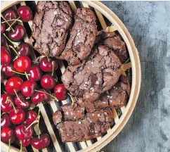  ??  ?? Dark chocolate chunks and ground coffee give these Deep, Dark Espresso Icebox Cookies a bold taste profile.