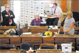  ?? Zach Boyden-holmes ?? The Associated Press State Rep. Brian Meyer of Polk County questions state Rep. Shannon Lundgren of Dubuque on the floor of the Iowa House as legislator­s debate the “heartbeat” bill Tuesday at the state Capitol in Des Moines.