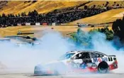  ?? SEAN GARDNER/GETTY IMAGES ?? Kevin Harvick does a burnout after his win Sunday led Ford to a sweep of the top three spots at Sonoma Raceway.