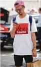  ?? Getty Images ?? A Paris shopper wears the Supreme x Louis Vuitton T-shirt.