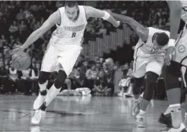  ?? David Zalubowski, The Associated Press ?? Indiana Pacers forward Paul George fouls Nuggets forward Danilo Gallinari during the first half of Sunday’s game at the Pepsi Center.