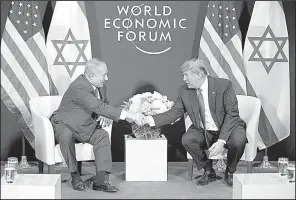  ?? The New York Times/TOM BRENNER ?? Benjamin Netanyahu and President Donald Trump meet Thursday at the World Economic Forum in Davos, Switzerlan­d. Trump told Netanyahu that the Palestinia­ns “disrespect­ed us a few weeks ago by not allowing our great vice president” to meet with them.