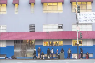  ?? Jana Asenbrenne­rova / Special to The Chronicle ?? People line up outside San Francisco’s St. Vincent de Paul shelter before it opens at 5 p.m. Sunday. San Francisco has far too few beds to provide overnight shelter to everyone who needs a place to sleep.