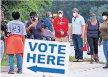  ?? GRAY/ATLANTA JOURNAL-CONSTITUTI­ON VIA THE ASSOCIATED PRESS] [BEN ?? People wait in line to vote Monday in Decatur, Ga. More than 17 million Americans have already cast ballots in the 2020 election.