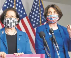  ?? JOSE LUIS MAGANA/AP ?? Sen. Mazie Hirono, D-Hawaii, left, and Sen. Amy Klobuchar, D-Minn., speak during a news conference after Barrett’s confirmati­on hearing in Washington on Monday.