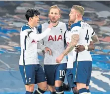  ??  ?? Harry Kane, above centre, and Gylfi Sigurdsson both scored twice as Tottenham and Everton played out a 2-2 draw in last night’s Premier League game. The England striker limped off with an injury near the end.