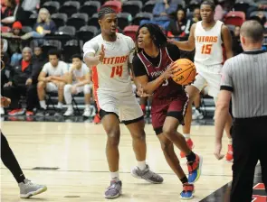  ?? (Special to the Commercial/William Harvey) ?? Pine Bluff senior Braylen Hall dribbles the ball down the baseline.