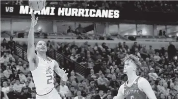  ?? NAM Y. HUH AP ?? UM’s Isaiah Wong shoots in front of Iowa State’s Aljaz Kunc during the second half of the Hurricanes’ 70-56 win.