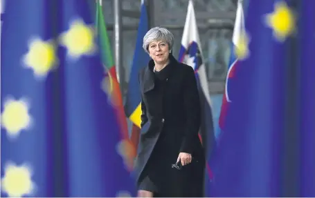  ?? Pictures: Getty. ?? Theresa May called for early agreement on an ‘implementa­tion period’ lasting around two years after the official date of withdrawal in March 2019.