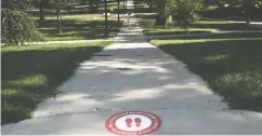  ?? Matt hew Hatc her / Gett y Images ?? The usually busy Oval at Ohio State University appears abandoned on Thursday. Students in the U. S. are questionin­g the value of tuition under pandemic conditions.