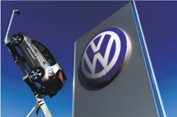  ?? Patrik Stollarrz / AFP / Getty Images ?? The Volkswagen pollution cheating scandal has many, including legislator­s, calling for the German automobile manufactur­er to be held accountabl­e.