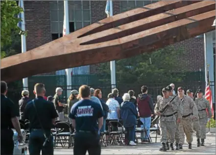  ?? PETE BANNAN – DIGITAL FIRST MEDIA ?? Members of the Parkesburg VFW post 4480 take part in the the National Iron & Steel Heritage Museum’s “Coatesvill­e Remembers September 11th” commemorat­ive service Monday morning. Above their heads is one of the Lukens Steel-produced 50-ton World Trade...