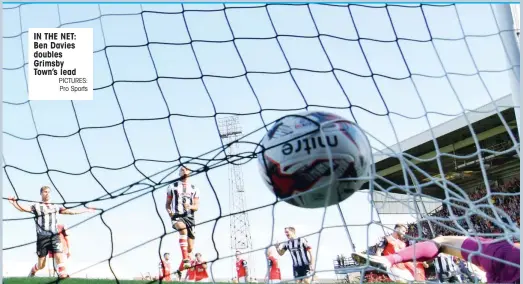  ?? PICTURES: Pro Sports ?? IN THE NET: Ben Davies doubles Grimsby Town’s lead