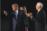  ?? Andrew Harnik / Associated Press ?? President Trump points to supporters while onstage with Vice President Mike Pence and first lady Melania Trump on the third day.