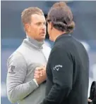  ?? MATTHEW LEWIS/GETTY IMAGES ?? Henrik Stenson, left, and Phil Mickelson shake hands after their third round together at Royal Troon. Stenson took the lead with a three-under-par 68.
