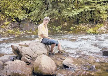  ?? SHAWN POYNTER/THE NEW YORK TIMES ?? Novelist Richard Powers, pictured in Townsend, Tennessee, said his new book, “Bewilderme­nt,” came to him when he imagined a child talking to him in a forest.