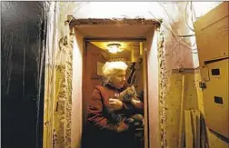  ?? ?? RAISA Yakovenko, 61, lives alone in a damaged apartment with her kitten, Javelinka, named after the antitank missiles used by Ukrainian forces.