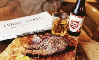  ?? Photos by J.C. Reid / Contributo­r ?? Those across the pond can sate their growing desire for American smoked meat with brisket and beer at Texas Joe’s, a Texas-style barbecue joint in London.