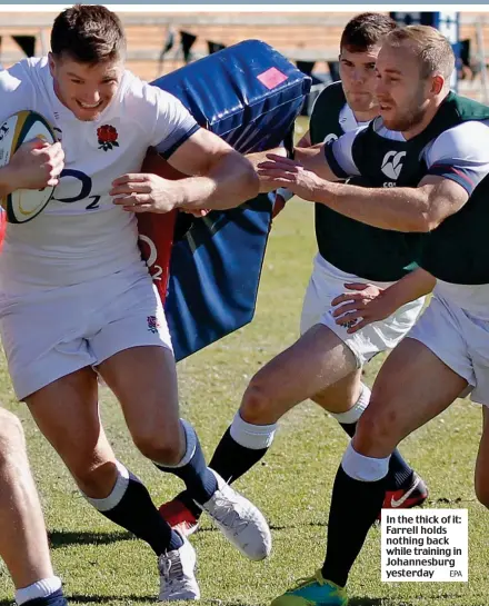  ?? EPA ?? In the thick of it: Farrell holds nothing back while training in Johannesbu­rg yesterday