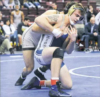  ?? Tom Elling/Tri-State Sports & News Service ?? Logan Pollick, right, helped Kiski Area take a short-lived 22-17 lead with a decision against Joe Kurtz of Bethlehem Catholic at 182 pounds Saturday in Hershey, Pa.