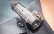  ?? MARLA BROSE/JOURNAL ?? A lapel camera worn by an APD officer. APD is facing claims it edited videos made during police shootings.