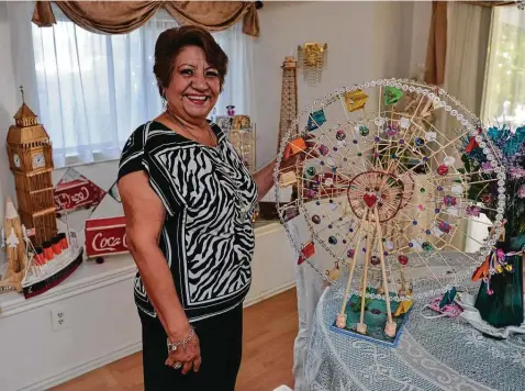  ?? Photos by Robin Jerstad / Contributo­r ?? Inspired by her grandchild­ren, Estela Mehring builds detailed miniatures — a Ferris wheel, a model of the Eiffel Tower, a dollhouse and more — from common craft items, toothpicks and skewers.