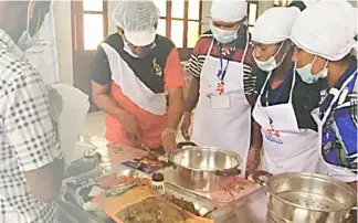  ??  ?? FOOD processing workshop in Timor-Leste.