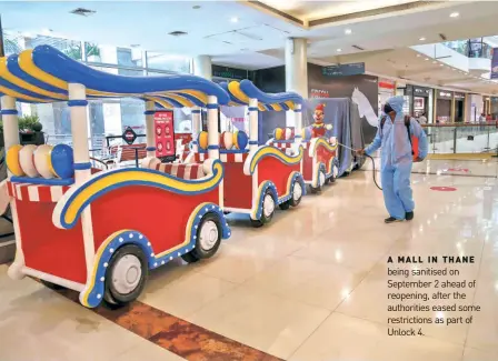  ??  ?? A MALL IN THANE being sanitised on September 2 ahead of reopening, after the authoritie­s eased some restrictio­ns as part of Unlock 4.