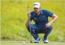  ?? PHOTO BY SILAS WALKER/LEXINGTON HERALD-LEADER VIA AP ?? Troy Merritt lines up a putt at the Barbasol Championsh­ip tournament at Keene Trace Golf Club in Nicholasvi­lle, Ky.